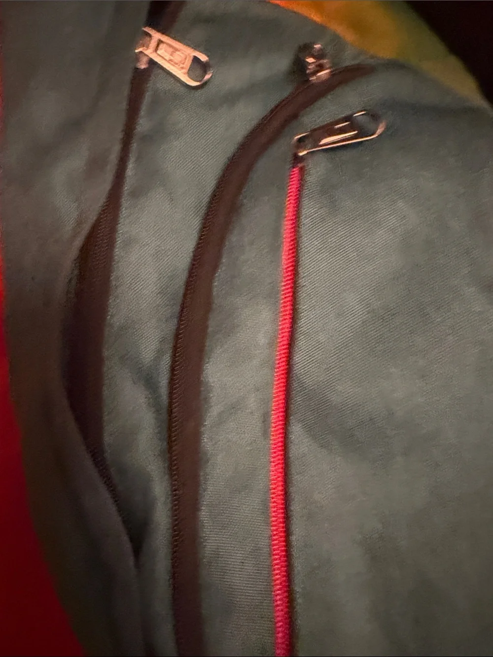 Teal Sling Backpack with Red Accent